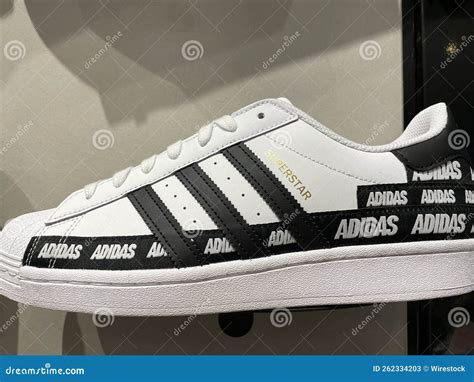 all white adidas with black stripes|More.